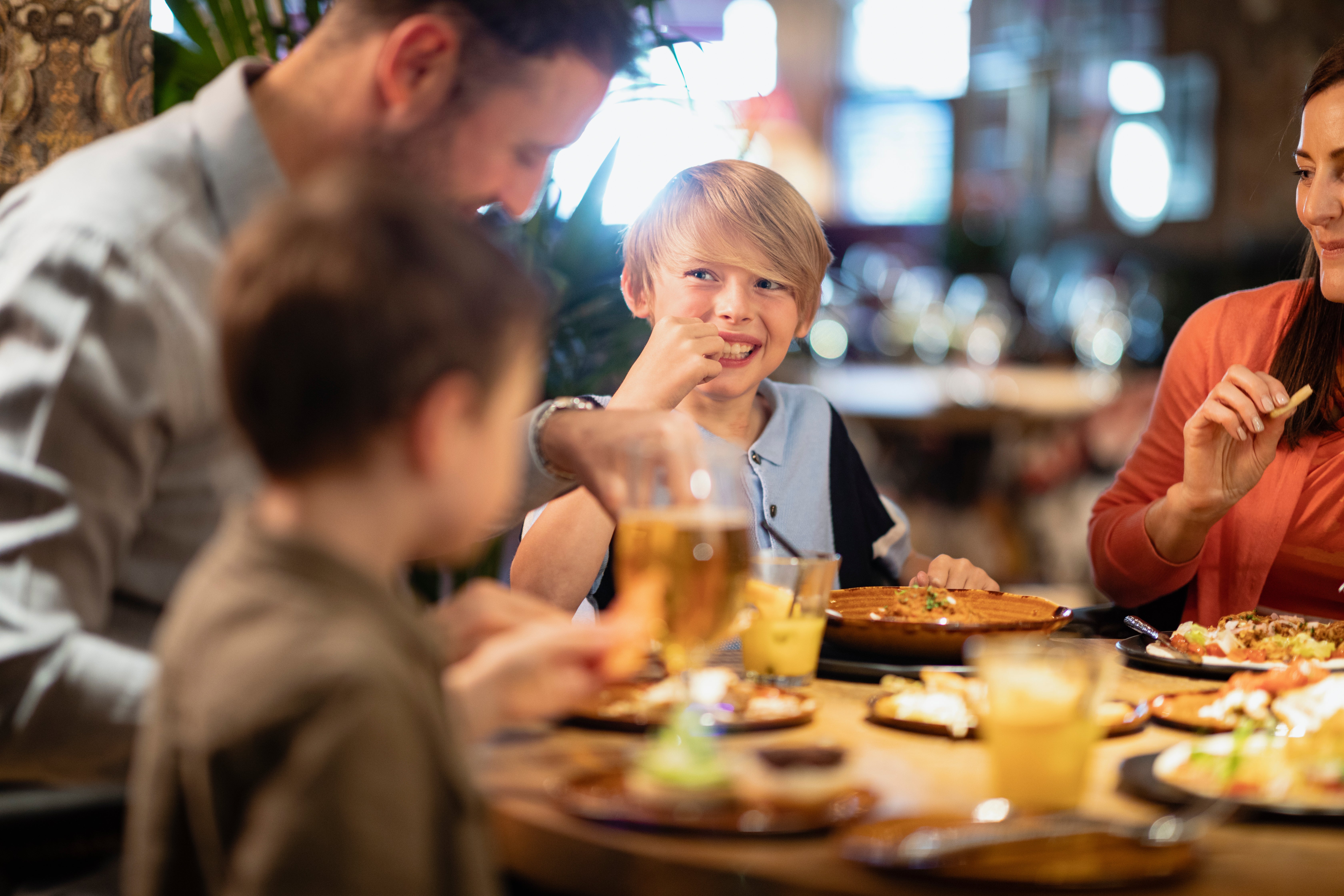 Family sharing meal at restaurant