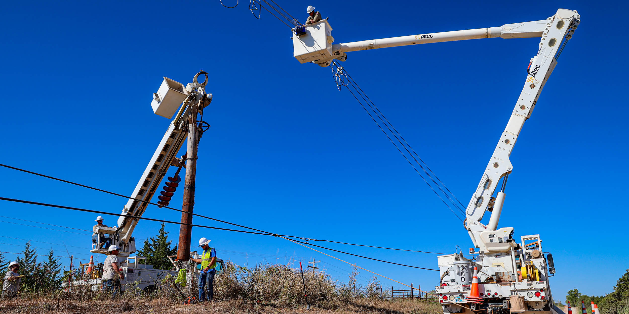 Central Lineman work on an electrical line and replacing a pole